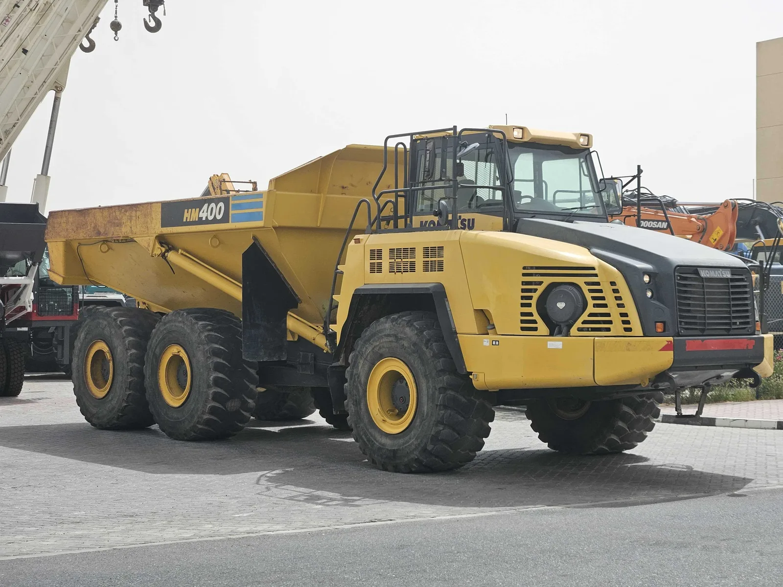 Komatsu HM400-3R articulated dump truck front side view with dump body