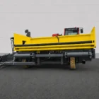 Road widening paver rear view showing the yellow hopper and support frame