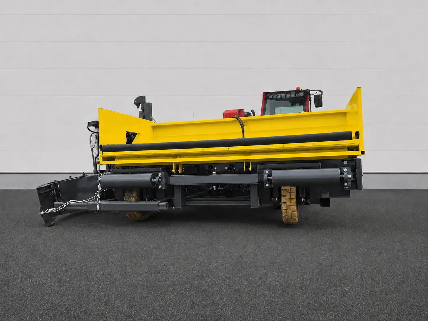 Road widening paver rear view showing the yellow hopper and support frame