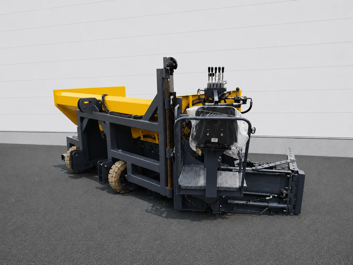Road widening paver front three-quarter view with operator seat and hydraulic controls