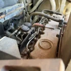 Voegele Super 1800-1 asphalt paver engine close-up with fuel lines and valve cover