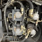 Voegele Super 1800-1 asphalt paver close-up of hydraulic pumps and hoses