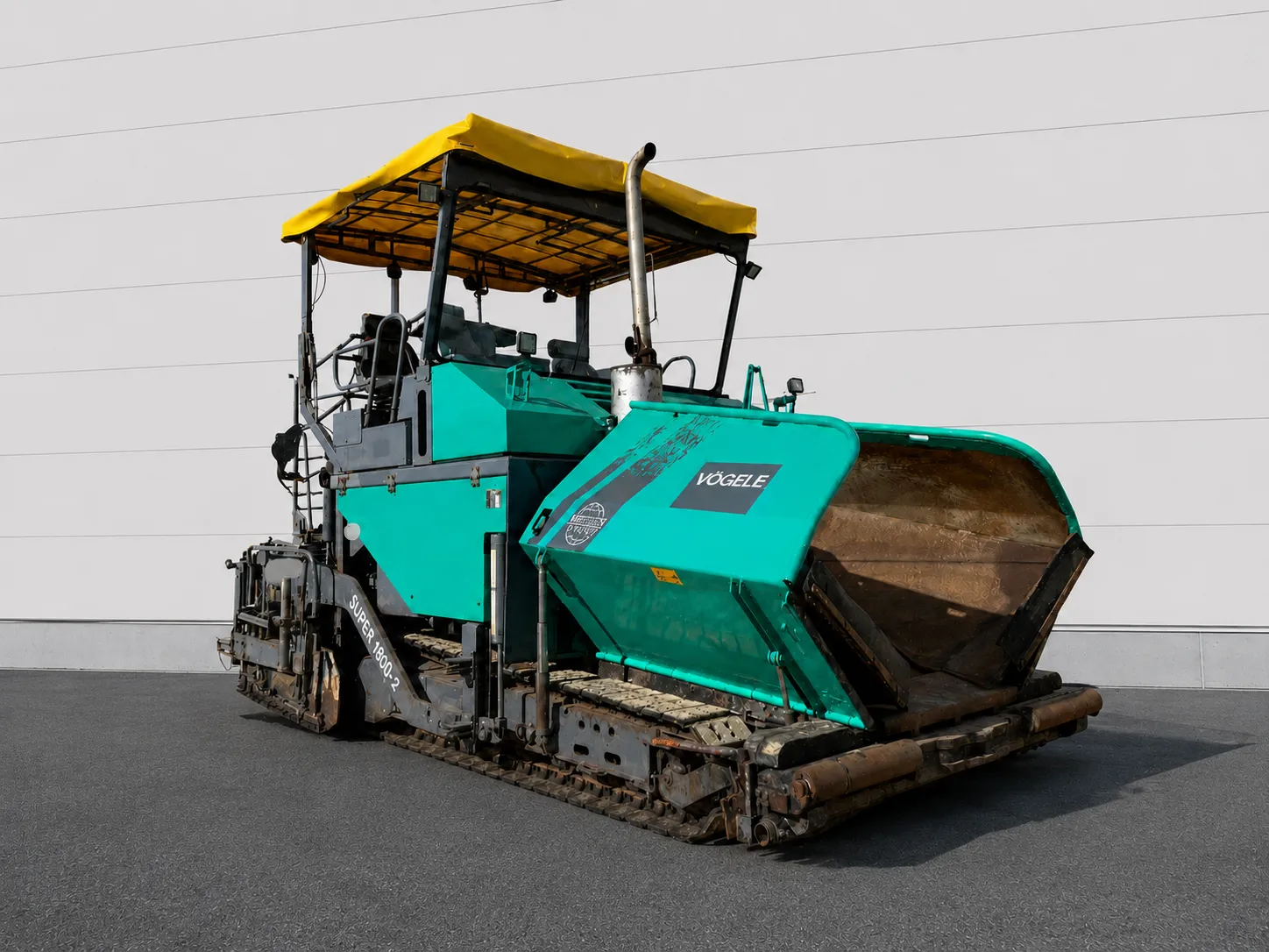 Voegele Super 1800-1 tracked asphalt paver front three-quarter view with material hopper
