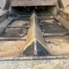 Voegele Super 1800-1 asphalt paver close-up of the hopper conveyor and central auger