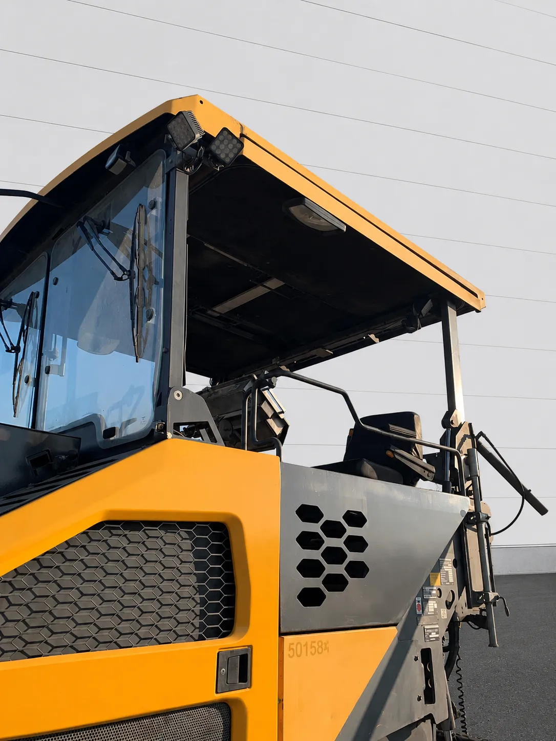 Volvo ABG P 8820 C asphalt paver close-up of the operator canopy and seat