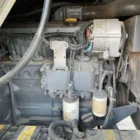 Voegele MT 1000-1 asphalt feeder engine compartment with engine, alternator and filters