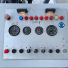 Voegele MT 1000-1 asphalt feeder operator control panel with gauges, indicator lights and switches
