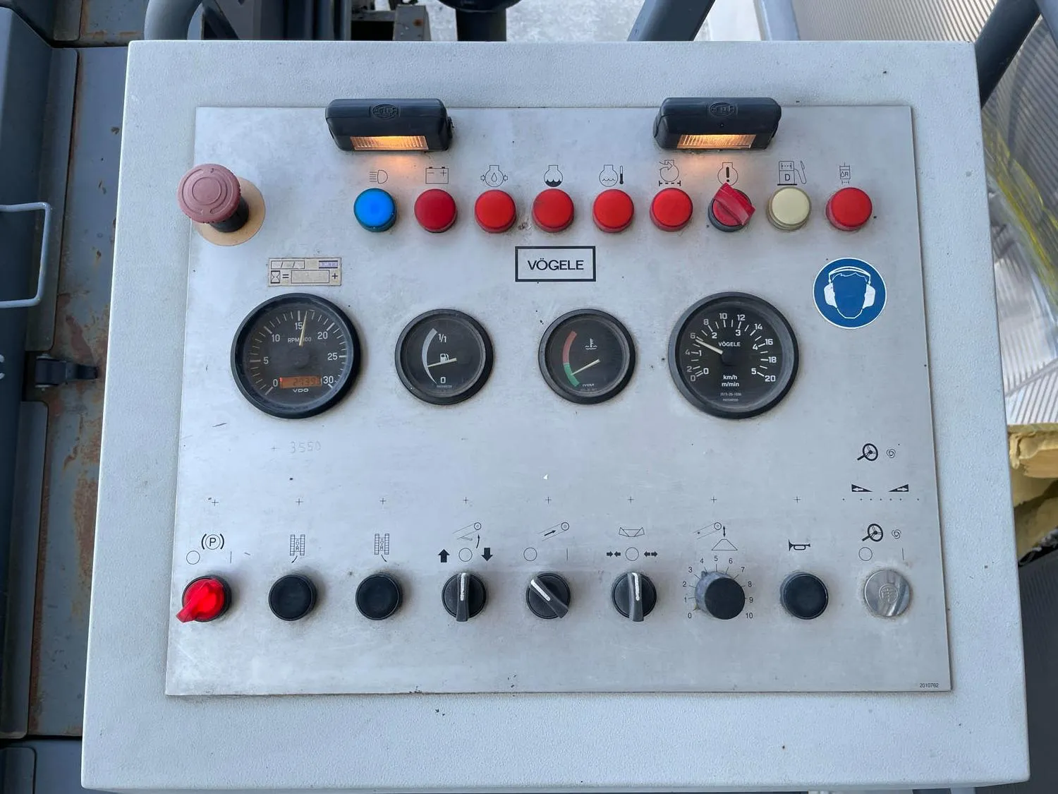 Voegele MT 1000-1 asphalt feeder operator control panel with gauges, indicator lights and switches