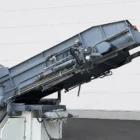 Voegele MT 1000-1 asphalt feeder close-up of the raised conveyor and hydraulic lines
