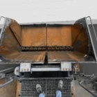Voegele MT 1000-1 asphalt feeder overhead view into the receiving hopper with material augers