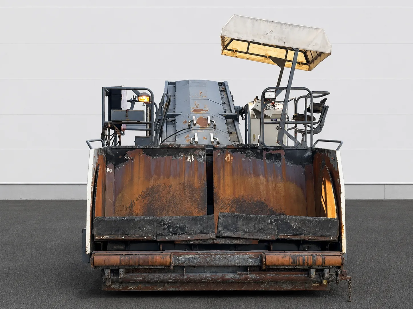 Voegele MT 1000-1 asphalt feeder front view of the receiving hopper and operator canopy