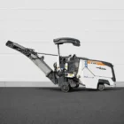 Wirtgen W 50 Ri cold milling machine side view with raised discharge conveyor