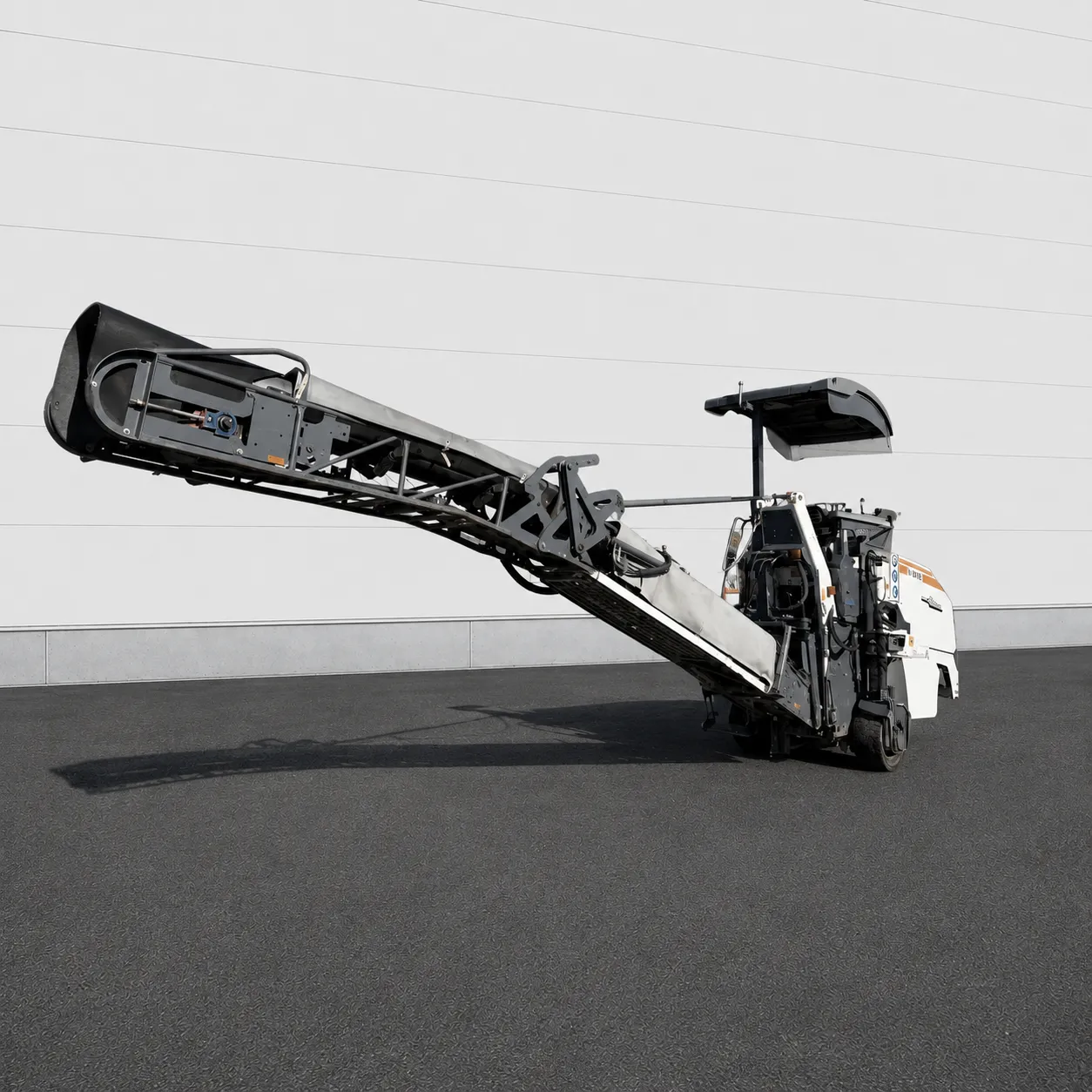 Wirtgen W 50 Ri cold milling machine side view with extended discharge conveyor