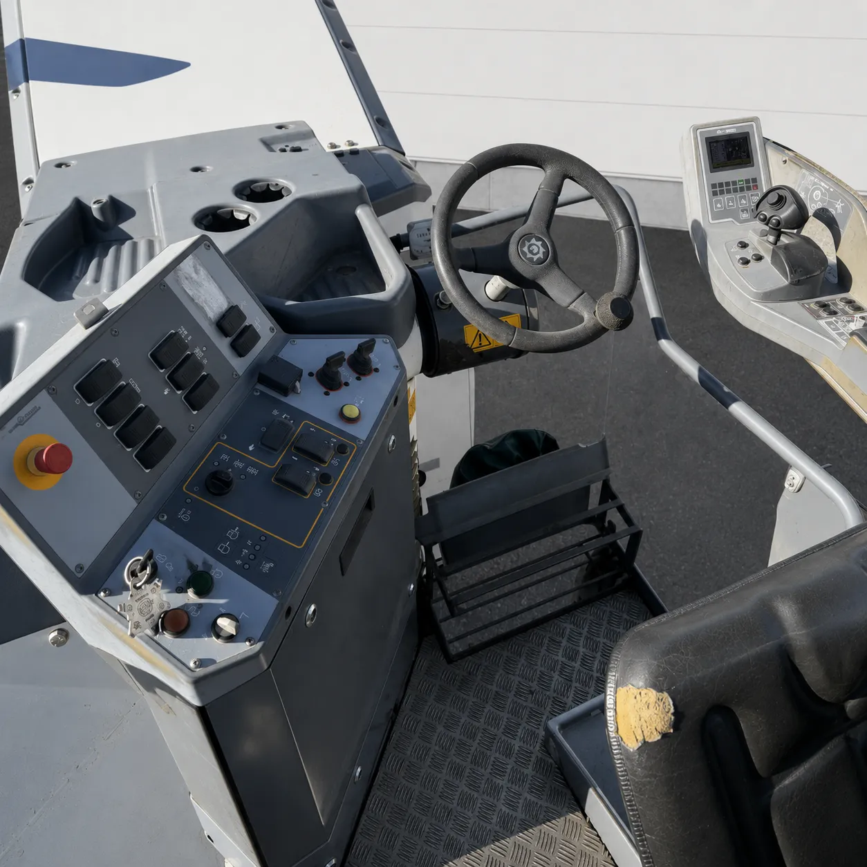 Wirtgen W 50 Ri cold milling machine operator station with steering wheel and controls
