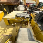 Sakai T2 asphalt roller operator station with steering wheel and controls