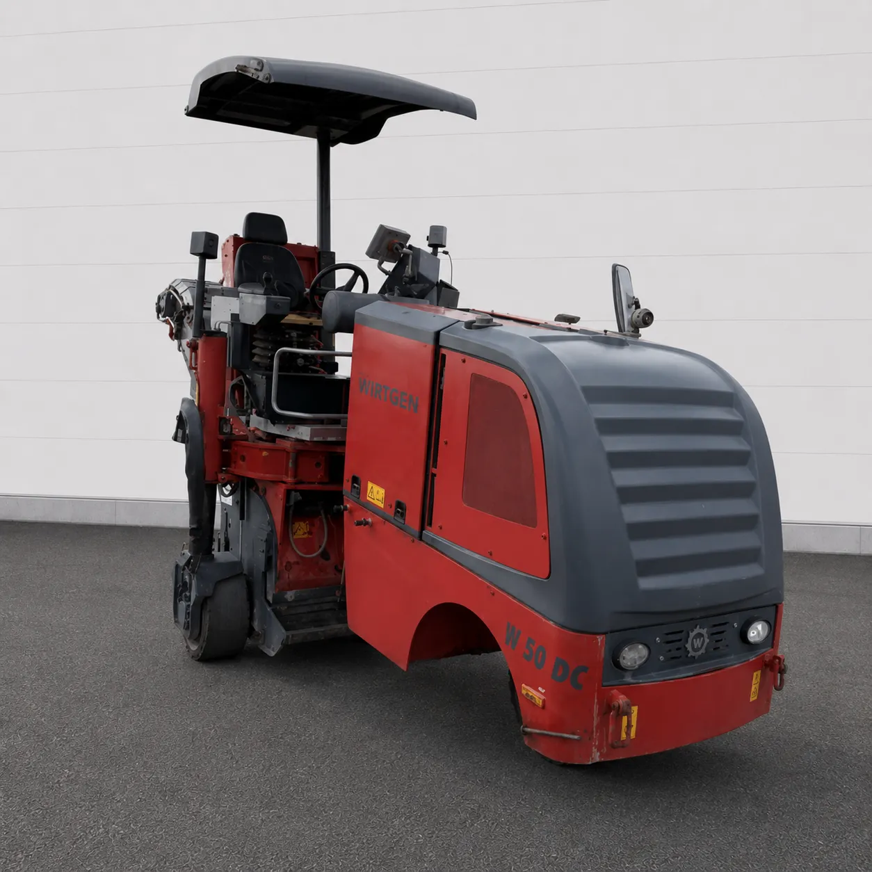 Wirtgen W 50 DC cold milling machine front three-quarter view with operator canopy