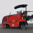 Wirtgen W 50 DC cold milling machine side view showing the operator station and conveyor
